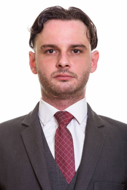 istock Face of young businessman against white background 668909036
