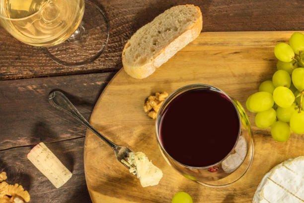 istock Wine tasting with bread, grapes, and cheese 668911944