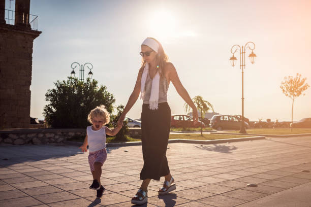 istock Mother and son in city walk 668916188
