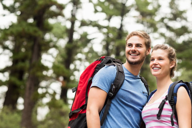 istock Young happy hikers looking in the distance 668917476