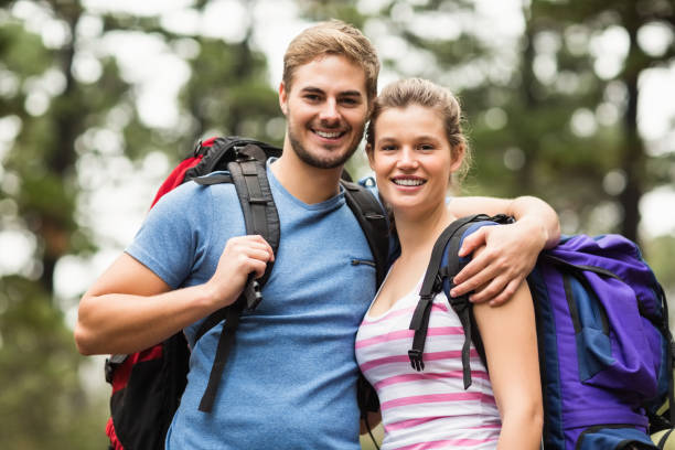 istock Portrait of young happy hikers 668919600