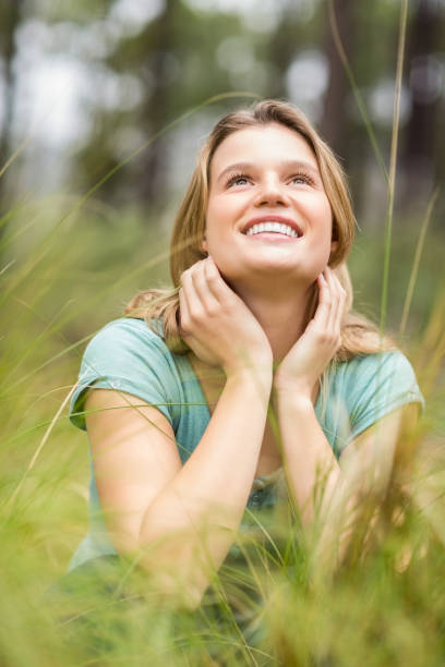 istock Young pretty hiker sitting in the high grass 668944410