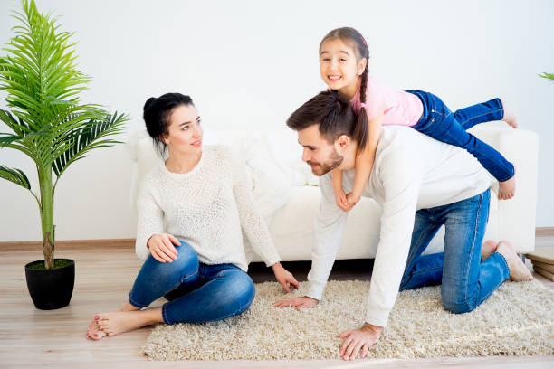 istock Family playing at home 668944516