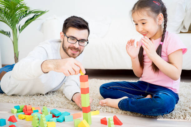 istock Family playing with toy blocks 668945104
