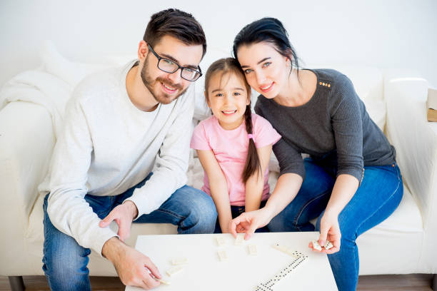 istock Family playing domino 668951072