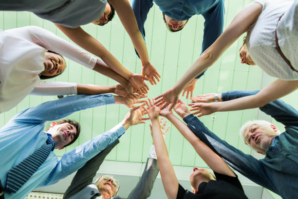 istock Working together.... hands of business team showing unity 668952224