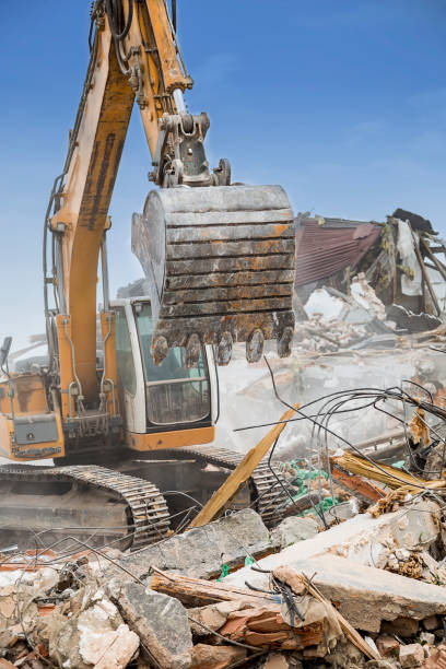istock Excavator demolishing barracks 2 668955260