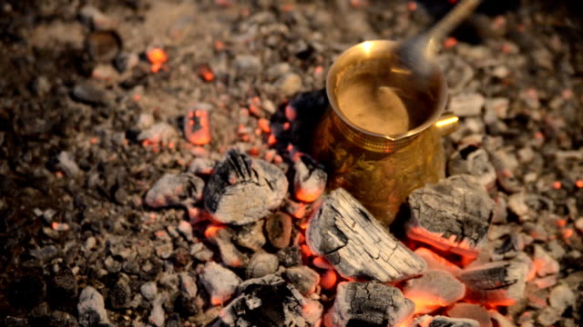 Traditional process boil Turkish coffee on coals.