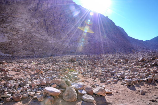 heap of huge stones in sandy desert at the hot sunny day