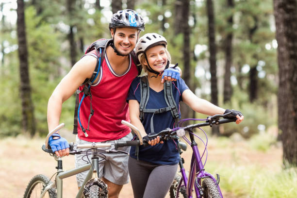 istock Happy young biker couple looking at camera 668965080