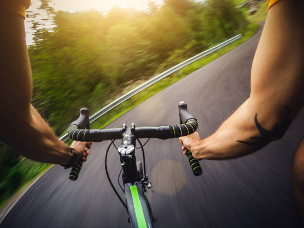 istock POV riding a road racing bicycle in the forest 668968740