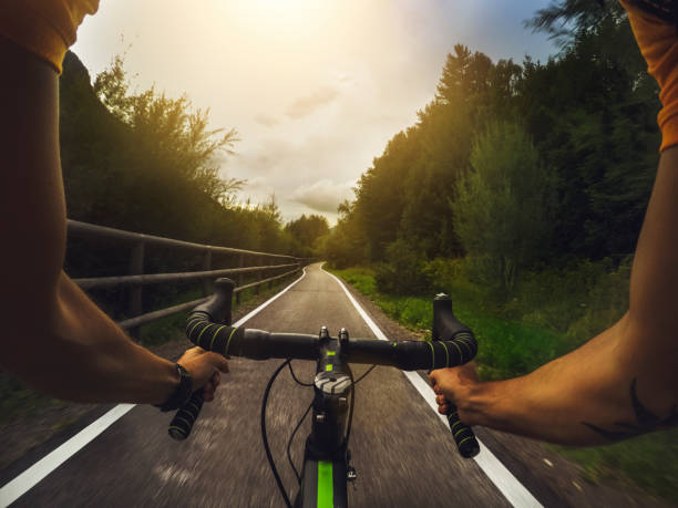 istock POV riding a road racing bicycle in the forest 668968770