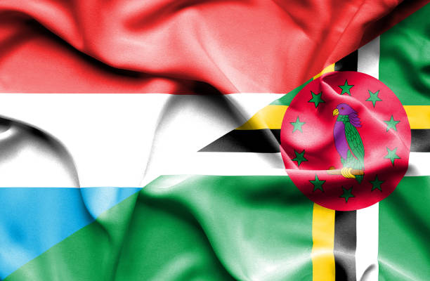 istock Waving flag of Dominica and Luxembourg 668976516