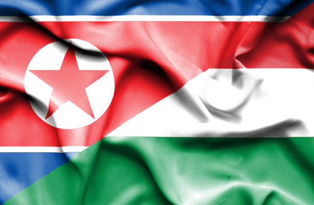 istock Waving flag of Hungary and North Korea 668983320
