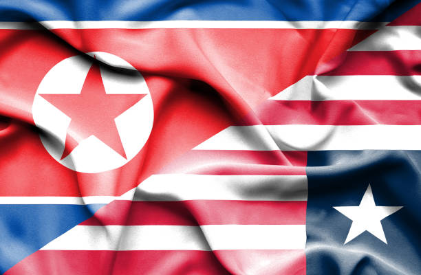 istock Waving flag of Liberia and North Korea 668983370
