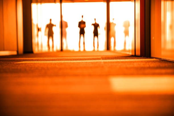 istock Businessmen shapes in the office 668985480