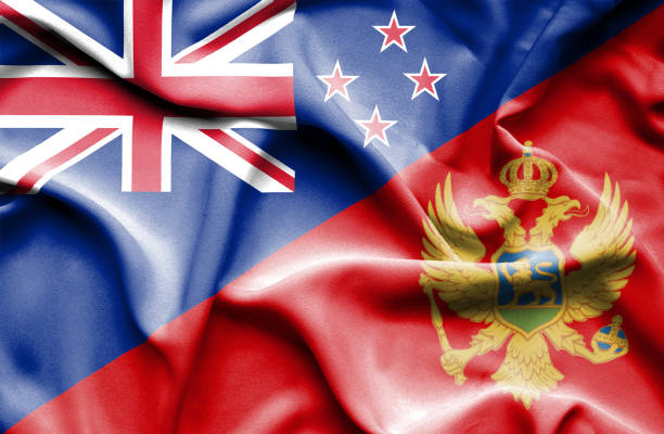 istock Waving flag of Montenegro and New Zealand 668986174
