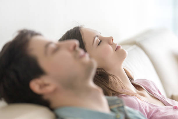 istock Happy young people relaxing with eyes closed, enjoying, side view 668986422