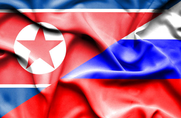 istock Waving flag of Russia and North Korea 668989448