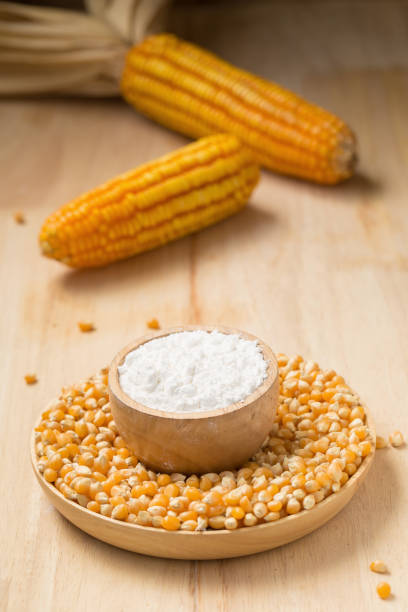 istock Corn flour in a bowl over a wooden table 668990500