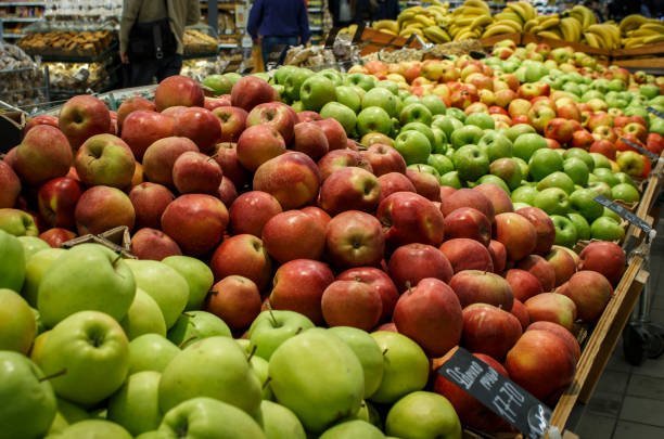 istock Red and green apples in a supermarket 668990542
