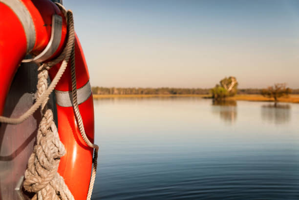 water safety bouy on boat in yellow water billabong at dawn, northern territories, australia - kakadu national park national park northern territory kakadu imagens e fotografias de stock