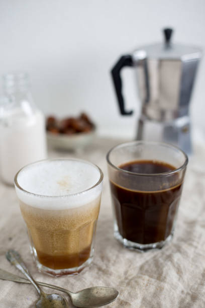 istock Hot latte and black coffee on white background. Morning concept 668992918