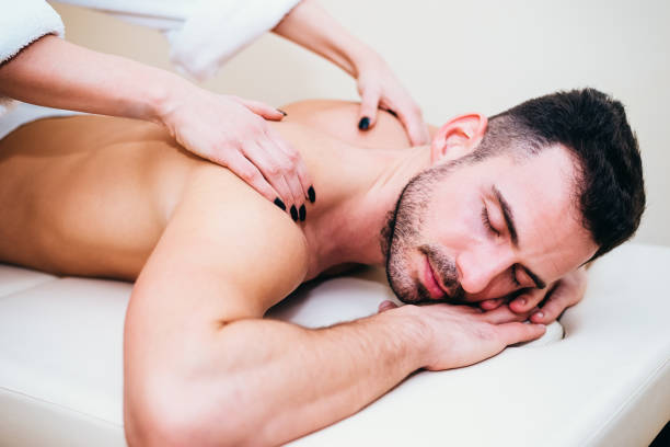 istock Man having back massage from masseur in spa 668993766