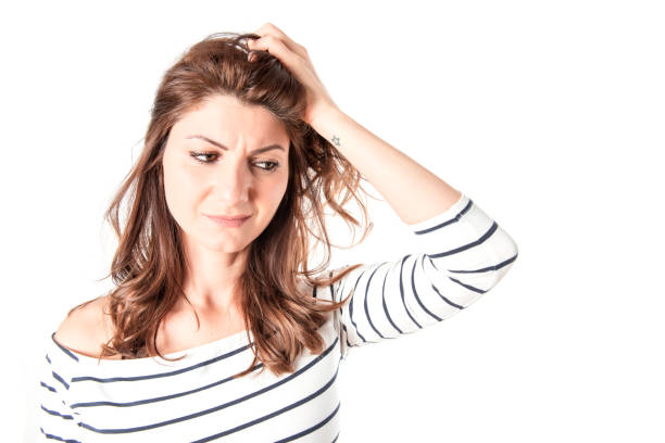 istock A thougthful white woman on a white background 668996658