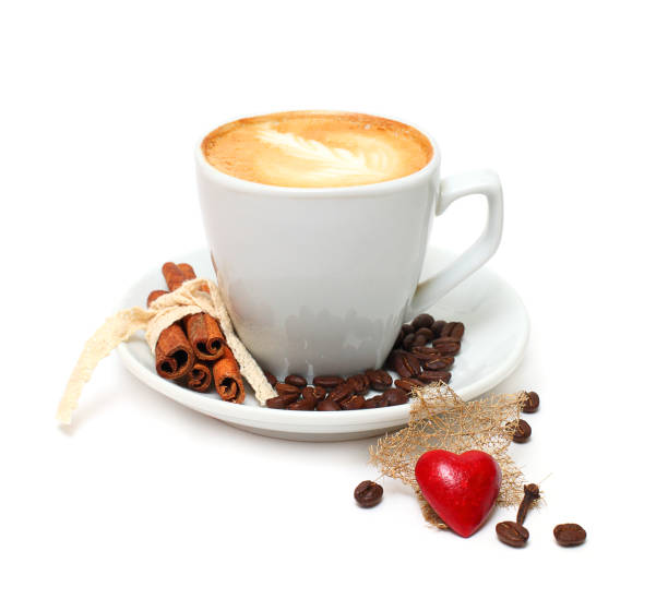 istock Coffee cup with cinnamon and red heart candy 668997010