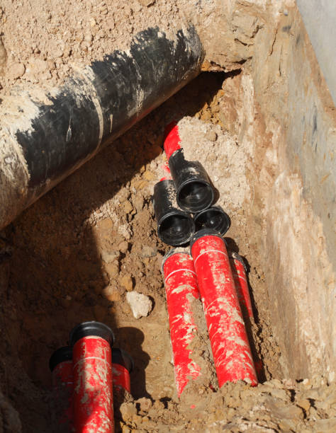 Pipes in the sand on a construction site, road works Pipes in the sand on a construction site, road construction work erde stock pictures, royalty-free photos & images