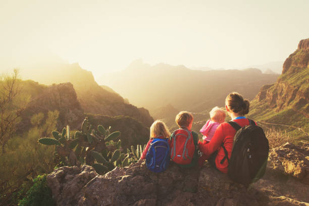istock mother with three kids hiking in mountains 669000432