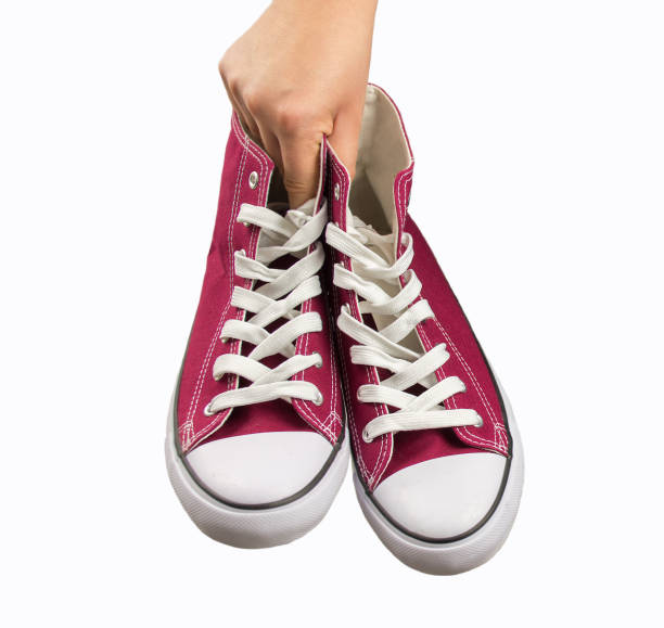 istock holding my sneakers 669006274