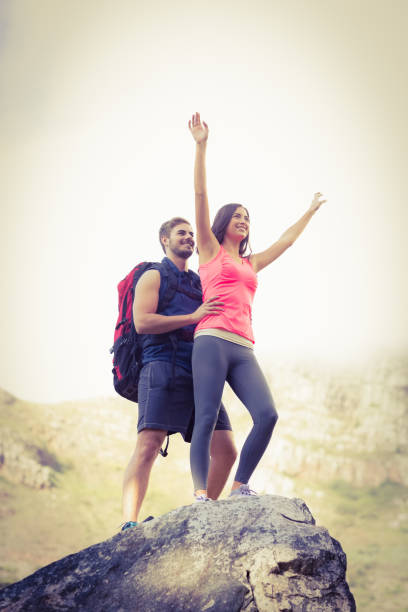 istock Young happy joggers posing on rock 669007226