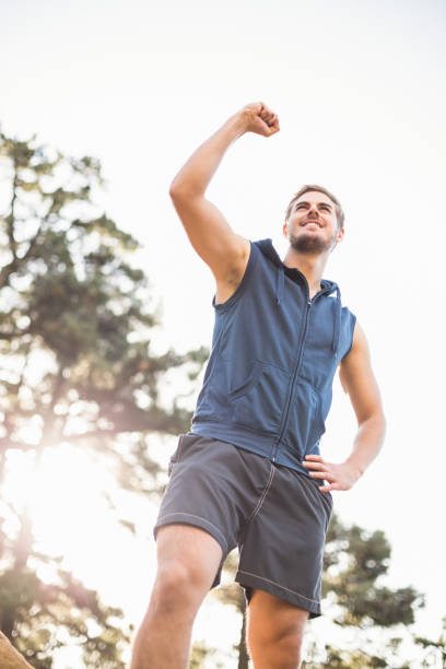istock Young happy jogger looking in the distance cheering 669012248