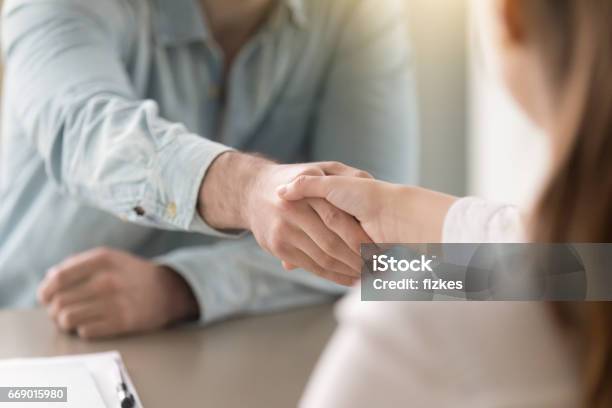 Business Agreement Handshake Of Man And Woman At The Office Stock Photo - Download Image Now