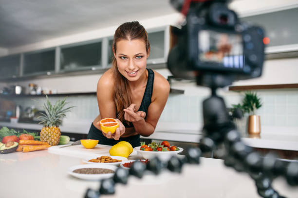 istock Young female blogger recording content for videoblog in Kitchen. 669038230