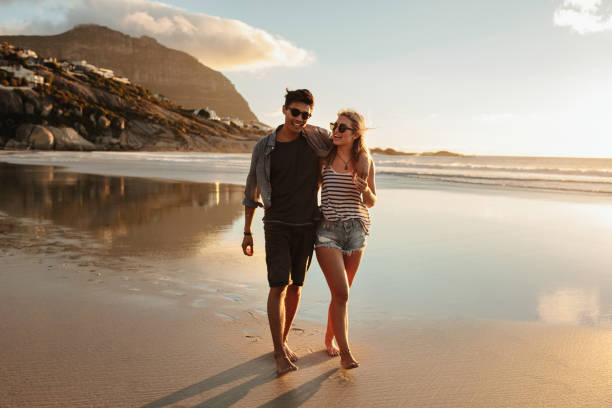istock Couple enjoying a day at beach 669043662