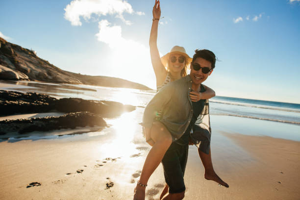 istock Couple enjoying beach holidays 669043770