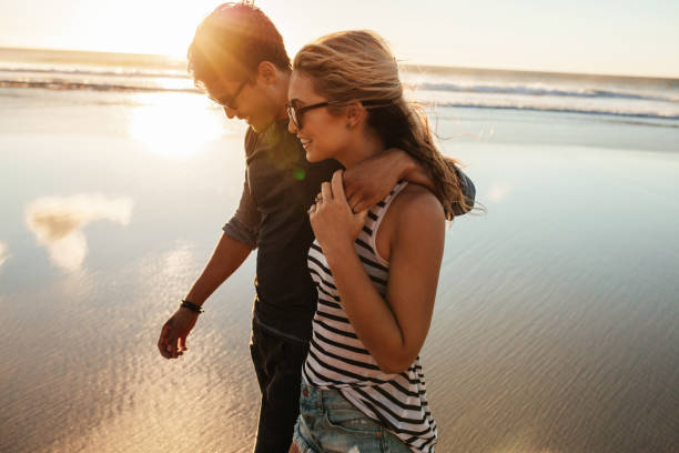istock Loving young couple on beach 669043990