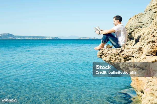 Man Reading Quietly Stock Photo - Download Image Now - Horizontal, March - Month, No People