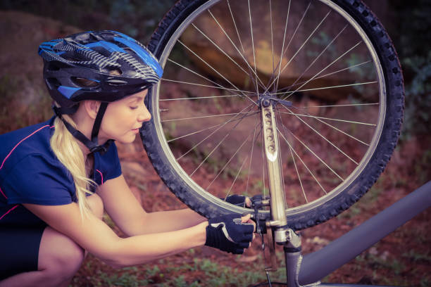 istock Athletic blonde checking her mountain bike 669057056