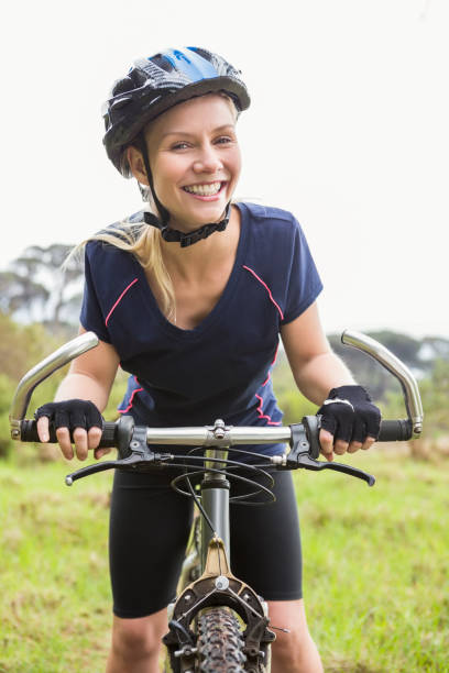 istock Smiling athletic blonde with mountain bike 669057148