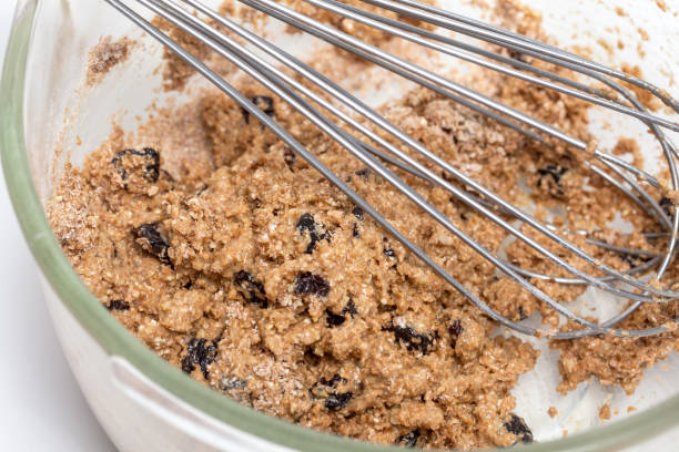 istock Mixing ingredients to prepare integral wheat bran muffins 669057176