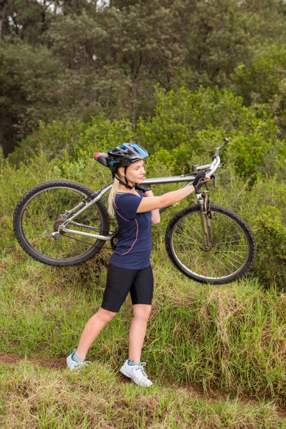 istock Athletic blonde carrying her mountain bike 669057442