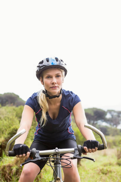 istock Focused athletic blonde mountain biking 669057546