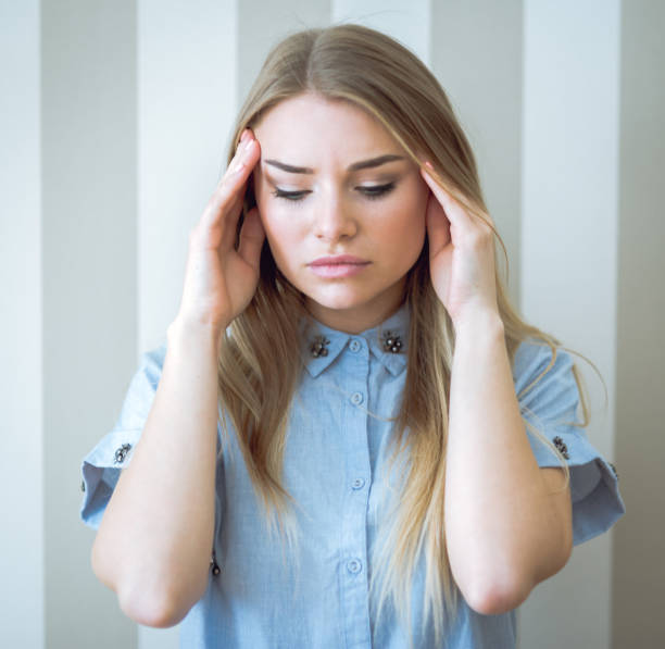 istock Adult woman with headache 669057826