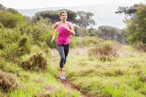 istock Pretty blonde athlete jogging 669057934