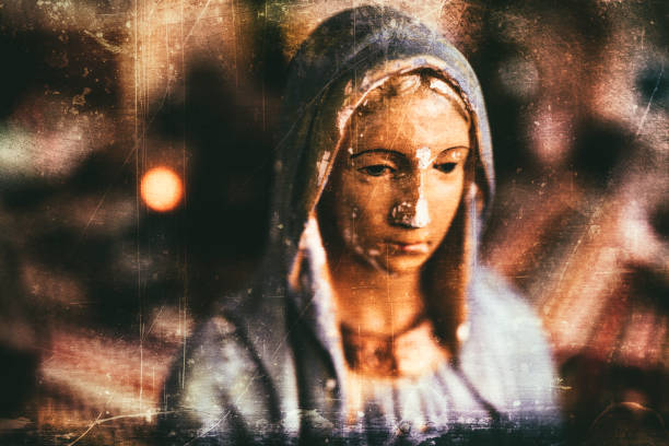 Grungy processing of an old and chipped plaster bust of Virgin Mary, one of the iconic figures of some Christian religion. Religious concept. virgin mary photos stock pictures, royalty-free photos & images