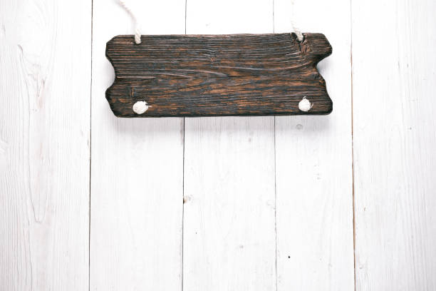 istock Signboard on white wood background 669071036